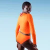 Liberty & Justice Women's Long Sleeve Cropped Rash Guard - Orange